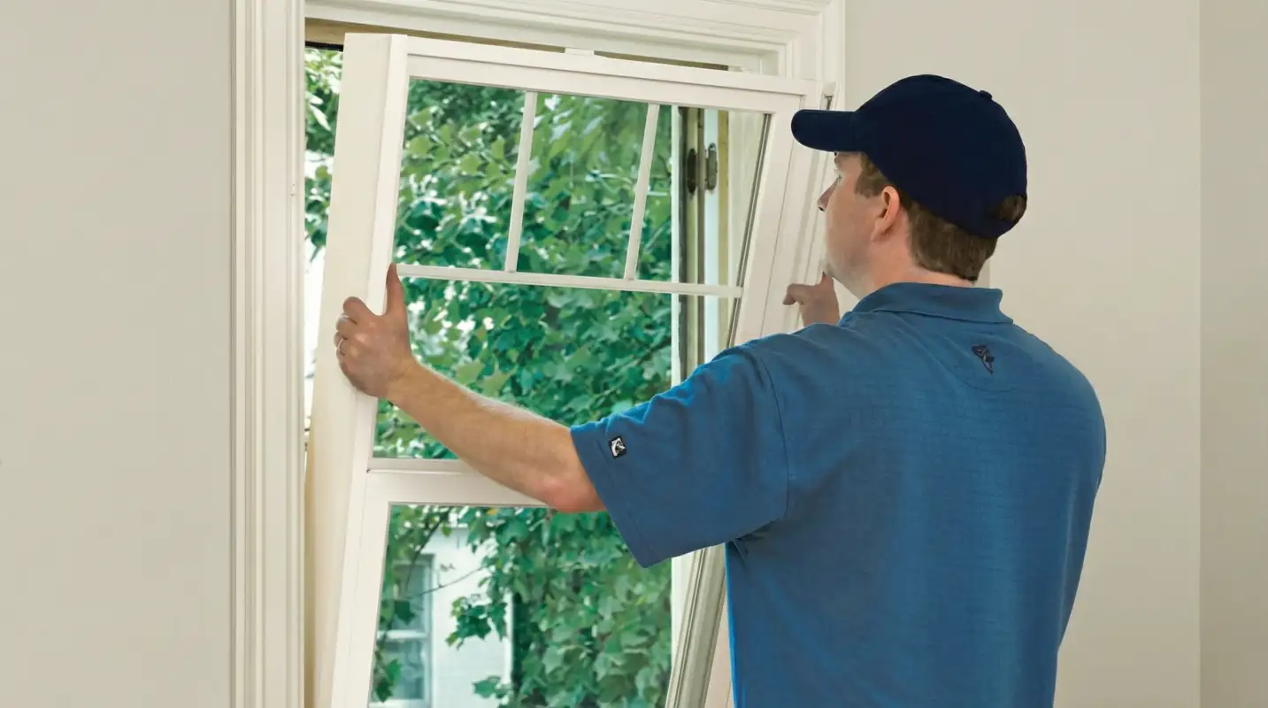 Professional contractors performing a residential window insulation and replacement service in Los Angeles, CA